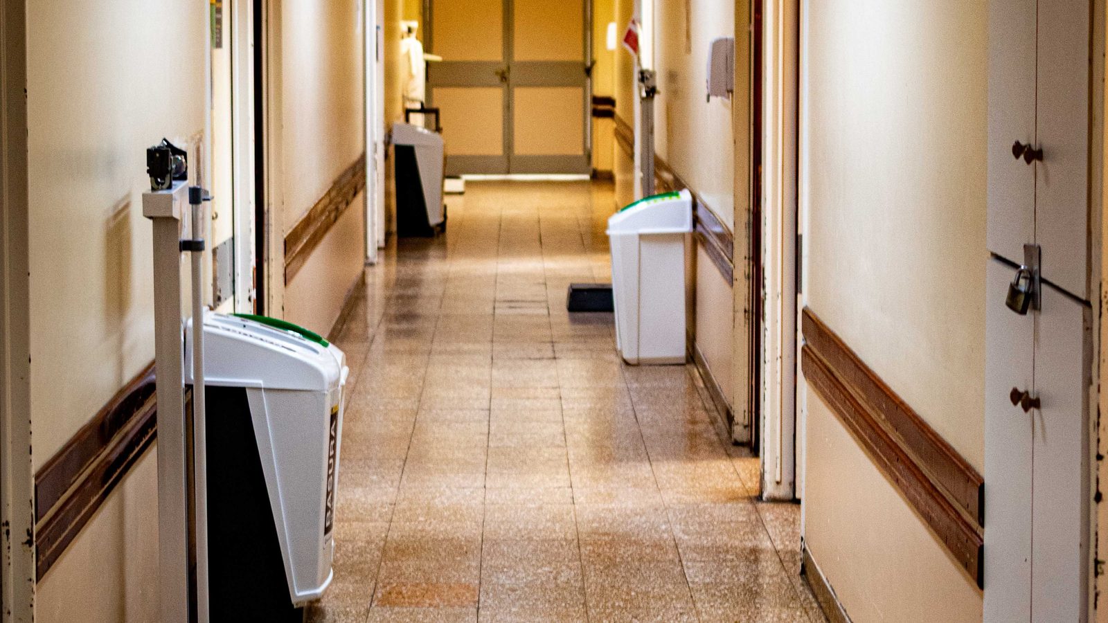 An empty corridor in a skilled nursing facility.